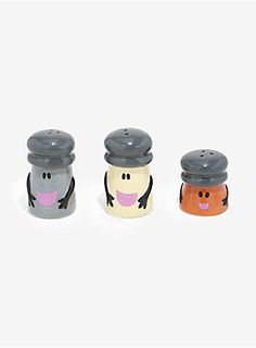 three salt and pepper shakers in the shape of cartoon characters with faces on them