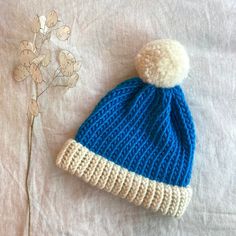 Our Sky blue two tone knitted bobble hat has been created by hand (we knit each one using traditional techniques). We believe in beautiful, practical and long lasting items which are unique, a joy to own and will be treasured for many years to come.  We use 100% wool to create our hats which makes them super warm and long lasting  || Features || - Sky blue and Natural Shetland  - Designed to fit snug to your head - 100% wool  - Available with or without a pom pom  - Pom pom (if requested) will b Blue Knit Beanie For Winter, Blue Knit Beanie Hat, Blue Knit Beanie Cap, Blue Knit Beanie For Cold Weather, Blue Acrylic Yarn Winter Hat, Blue Yarn Knitting Pattern For Winter, Blue Knit Beanie, Winter Knitting Pattern In Blue Yarn, Winter Blue Yarn Knitting Pattern