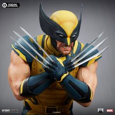 the wolverine action figure is posed with his hands on his chest and claws extended out