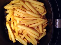 french fries are in a bowl on the stove