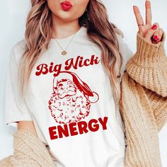 Get into the Christmas Spirit with a Christmas Cranky Tee! My tees are a 65% Polyester 35% Cotton blend for softness. They keep you cool, and they won't shrink. The benefit of a Cranky Tee is that I use sublimation. This means the ink fuses directly to the fabric of the shirt. Even with a full color large graphic, you cannot even feel it. No scratchy or thick transfers that peel or crack. Always super soft with our signature vintage prints. My shirts are Unisex sizing. I am 5'9" and 140 lbs. I w Big Nick Energy, Funny Santa Shirts, Funny Adult Shirts, 140 Lbs, Santa Shirt, Funny Dog Shirts, Black Santa, Funny Santa, Funny Holiday