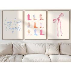 three paintings hang on the wall above a couch