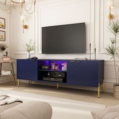 a living room with a large television on the wall and a blue cabinet in front of it