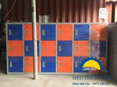 an orange and blue locker cabinet next to a metal pole