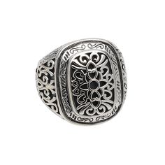 an ornate silver signet ring on a white background