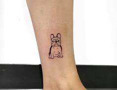 a small dog tattoo on the ankle