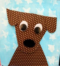 a dog made out of brown paper with polka dots on it's face and nose