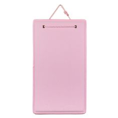 a pink clipboard hanging on a white wall