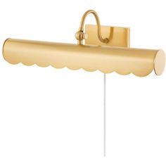 a brass colored wall light with a scalloped shade on the side and a white background