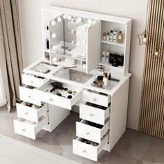 a white vanity with drawers and lights on it