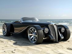 an unusual car is parked on the beach