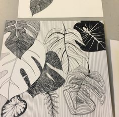 two black and white prints with leaves on them, one is drawn in pencil the other has an ink pen