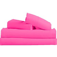 bright pink sheets and pillow cases are stacked on top of each other in this bedding set