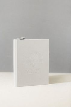 a white book sitting on top of a table