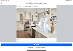 an image of a kitchen with white cabinets and counter tops on the website home page