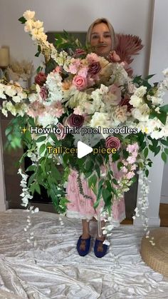 a woman standing in front of a large bouquet of flowers with the caption how to think about models