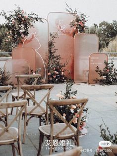 there are many chairs and tables with flowers on them in front of an outdoor area