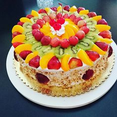 there is a cake with fruit on it