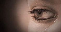 a woman's eye with water drops on it