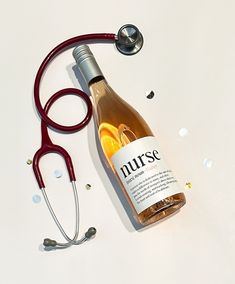 a bottle of wine with a stethoscope next to it