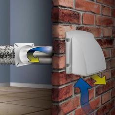 a brick wall with an electrical outlet attached to it and a white box on the side