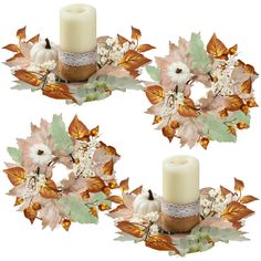 three white candles are surrounded by leaves and other autumn decor items on a white background