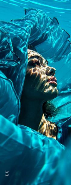 a woman is submerged in the water