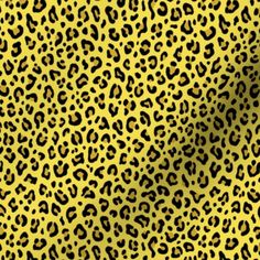 an animal print pattern in yellow and black, with spots on the back of it