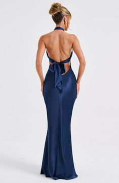 Feel opulent in Dimitra. a stunning maxi design crafted in delicate satin with a beautiful sheen and silky soft feel. Featuring a high cross over neckline and low back with tie detail. this style has a fit and flare silhouette and flattering piping under the bust. Keep things chic with barely there heels and sleek hair.   Colour: Navy. Premium non-stretch satin. Shaped piping under bust. Fit and flare silhouette. High cross over neckline. Tie detail to back. Low back. Invisible zipper to reverse. Maxi length. Model is an XS and is wearing an XS. Cocktail Dress Navy Blue, Navy Blue Backless Dress, Navy Blue Formal Dresses, Halter Long Dress, Blue Dress Long, Elegant Formal Dresses, Low Back Prom Dress, Backless Prom Dress, Navy Prom Dress