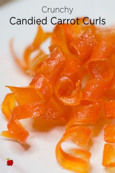 an image of candied carrot curls on a plate with the title crunchy candied carrot curls