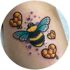 a bee with honeycombs on it's back and chest is shown in this tattoo