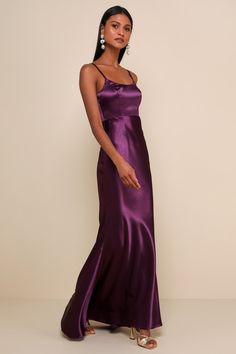 a woman in a long purple dress