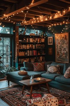 a living room filled with furniture and lots of lights hanging from the ceiling above it