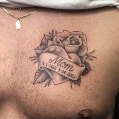 a man with a rose tattoo on his chest and the words mom written in it