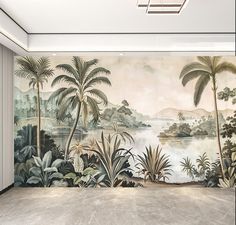 an empty room with a large mural on the wall and palm trees in the foreground