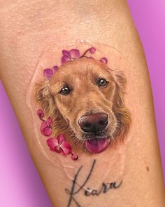 a close up of a dog's face with flowers on its head and the word kiss written in cursive writing