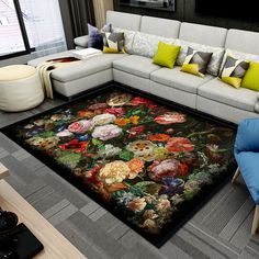 a living room with a large rug on the floor that has flowers painted on it