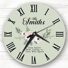 a clock with flowers on it and the words, the smiths time spent with family is time well spent