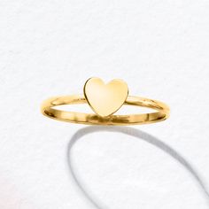 Ross-Simons - 10kt Yellow Gold Heart Ring Size 5. Canaria fine jewelry. Perfect for everyday wear, these genuine 10kt gold wardrobe essentials are fashionable, fun and designed to last a lifetime. Strong and durable, our collection of gold classics is always a great value. This handcrafted 10kt yellow gold ring presents a simple glossy heart. Wear it solo or stacked to keep love at the center of your style. 1/4" wide. 10kt yellow gold heart ring. Gold Wardrobe, Heart Ring Gold, 2000s Outfit, Yellow Ring, Gold Heart Ring, Yellow Rings, India Jewelry, Yellow Gold Ring, Gold Heart