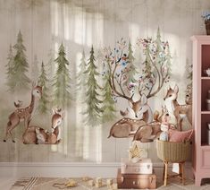 a room with deer and pine trees painted on the wall next to a pink dresser