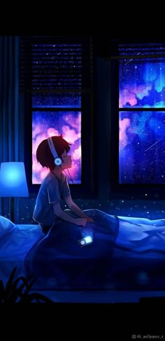 a person sitting on a bed with headphones in their ears and looking out the window