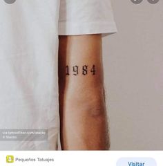 two people with numbers tattooed on their arms