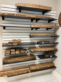 some type of shelf that is made out of wood and has writing on the shelves