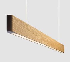 a wooden light fixture hanging from the ceiling