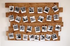 several photos hung on clothes pins and pinned to a wooden board with clothes pins hanging from them