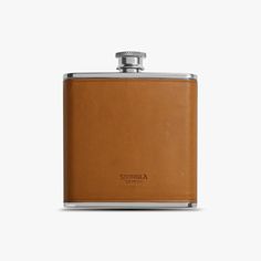 a brown flask with a silver top on a white background