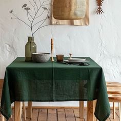 a green table cloth on top of a wooden table