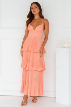 Length from bust to hem of size S: approx. 113cm. Chest: 36cm. Waist: 32cm. across front only of size S. Maxi dress. Semi-lined. Model is a standard XS and is wearing size XS. True to size. Non-stretch. Pleated design. Tiered flowy skirt. V-neck. Crisscross tie-up back. Elastic back. Zipper.  Cold hand wash only. Polyester. Channel your classy side in the Fashionably Ever After Maxi Dress. Featuring a pleated design. a tiered frill skirt and a crisscross tie-up back. Style with heels for a fancy event. Apricot Bridesmaid Dresses, Peach Dress Outfit Wedding, Coral Dress Outfit Wedding, Burnt Orange Dress Outfit, Coral Dress Outfit, Pastel Summer Dresses, Peach Prom Dresses, Peach Dresses, Fancy Event