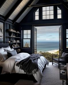 a bedroom with an ocean view is shown