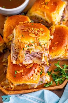 ham and cheese sliders cut in half on a cutting board